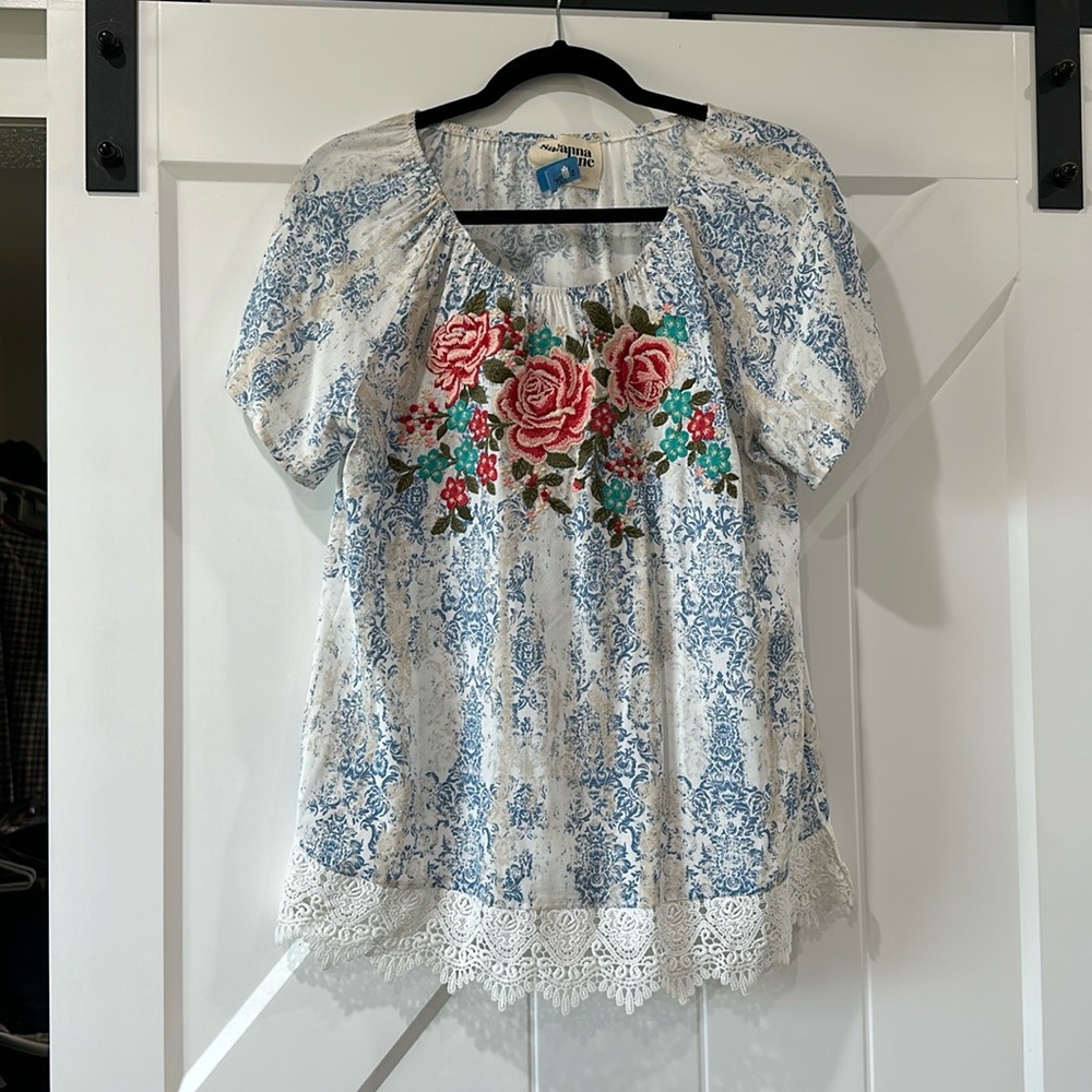 Embroidery blouse.